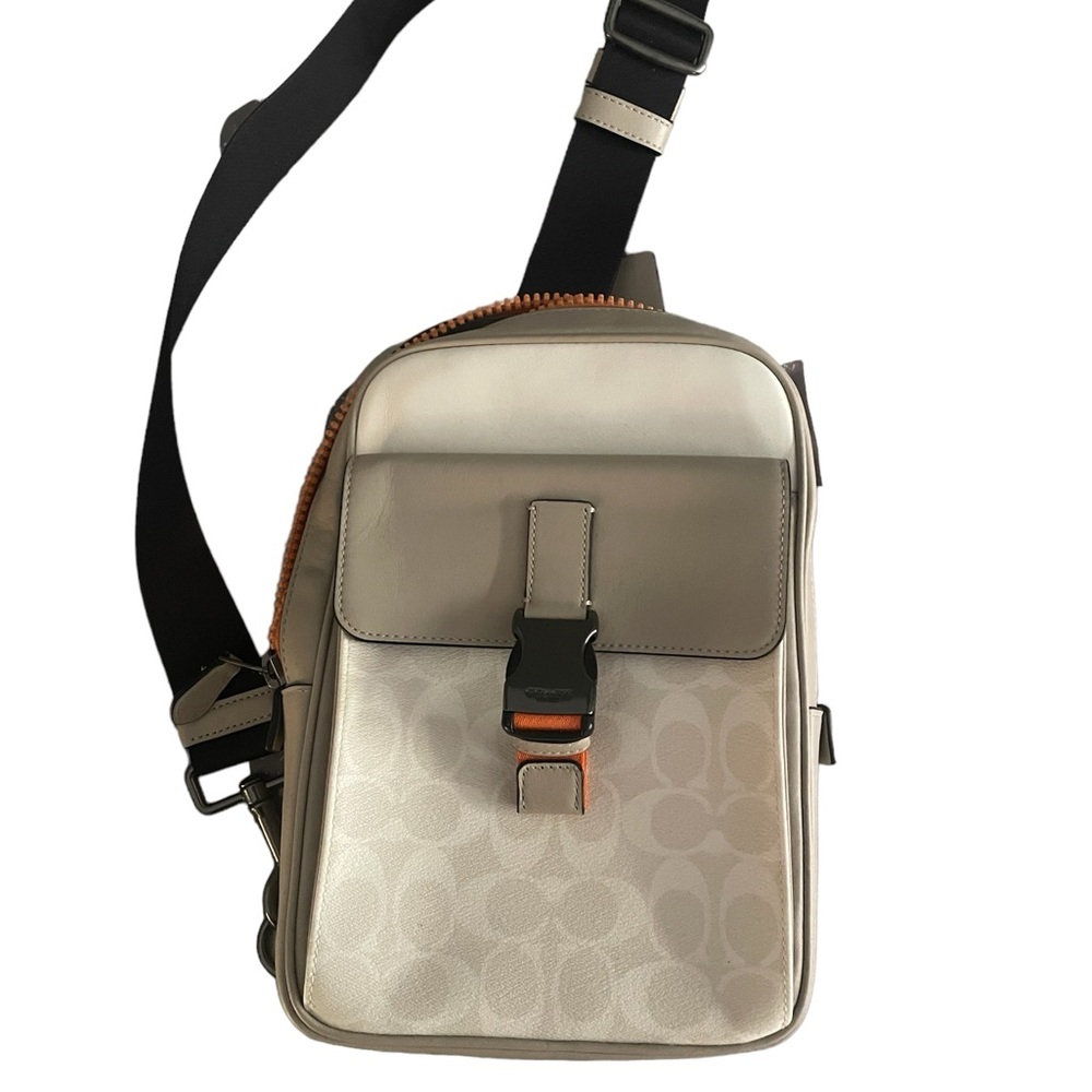 COACH Track Pack, Signature Canvas. Beige/cream color w orange accents.